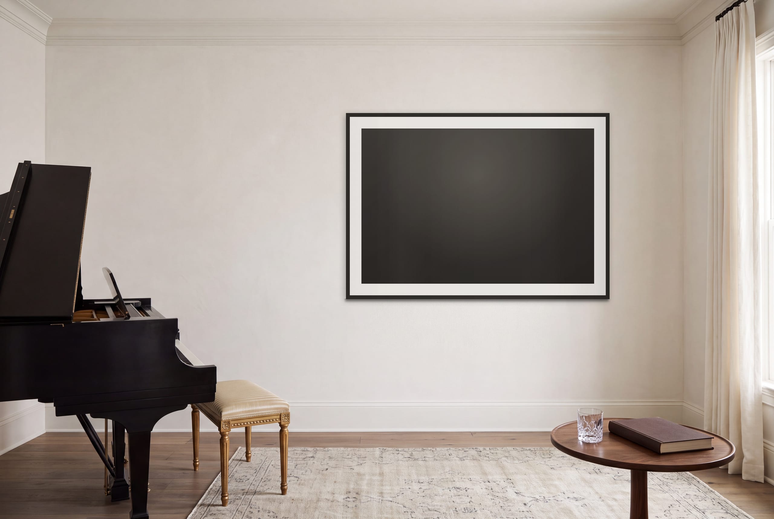 A framed work from the collection hung above a grand piano